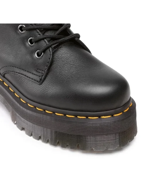 semelle crantée emblématique et la signature jaune de la marque Dr. Martens